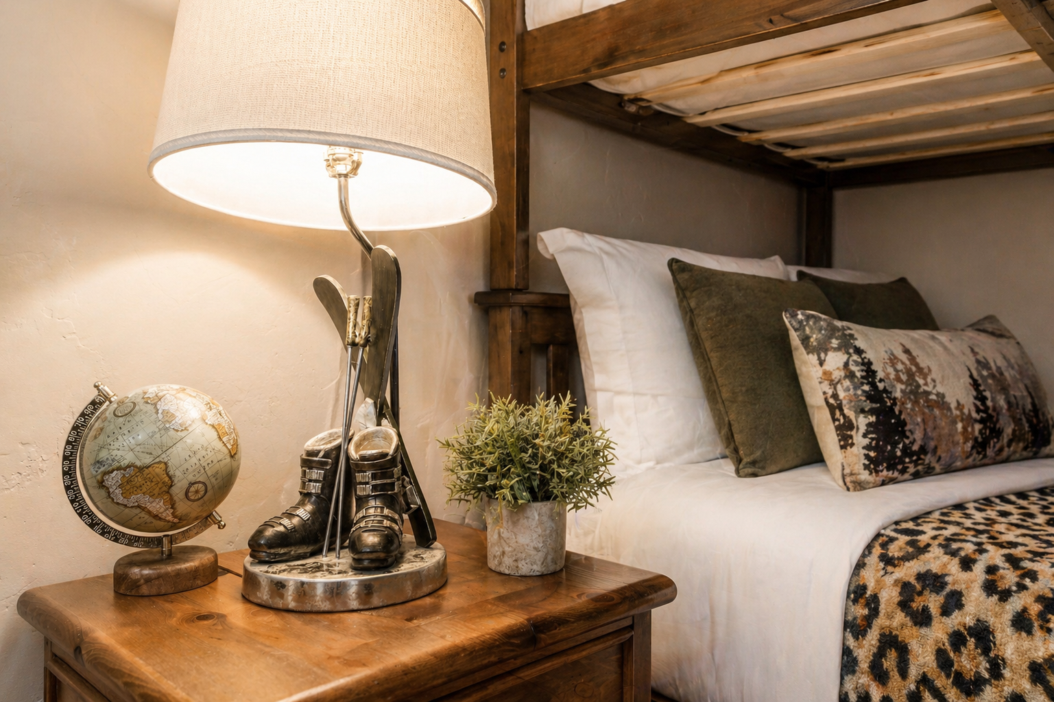 Unwind in your cozy bedroom, where rustic wooden beams meet crisp linens and thoughtful décor. Drift off in comfort, surrounded by warmth and charm.