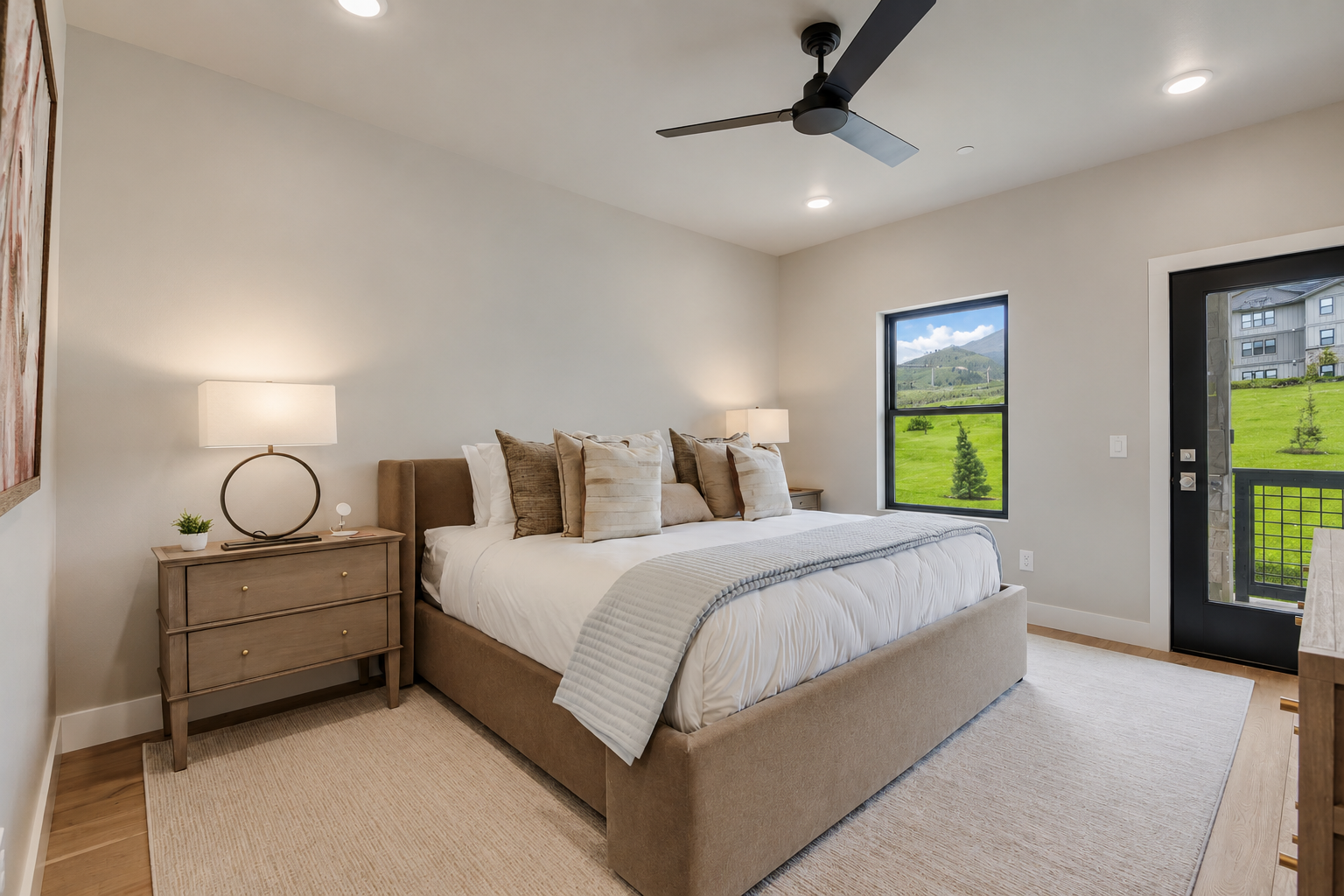 Wake to mountain views framed by your window, fresh linens welcoming you to unwind under the gentle breeze of ceiling fans in your serene bedroom retreat.