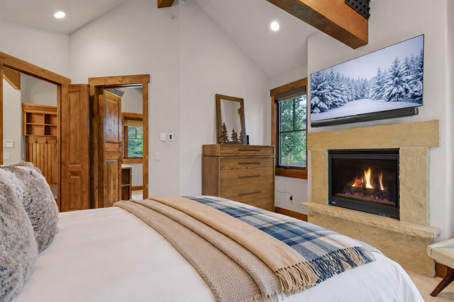 Retreat to the elegant upstairs king suite with a plush king-size bed and private balcony access.