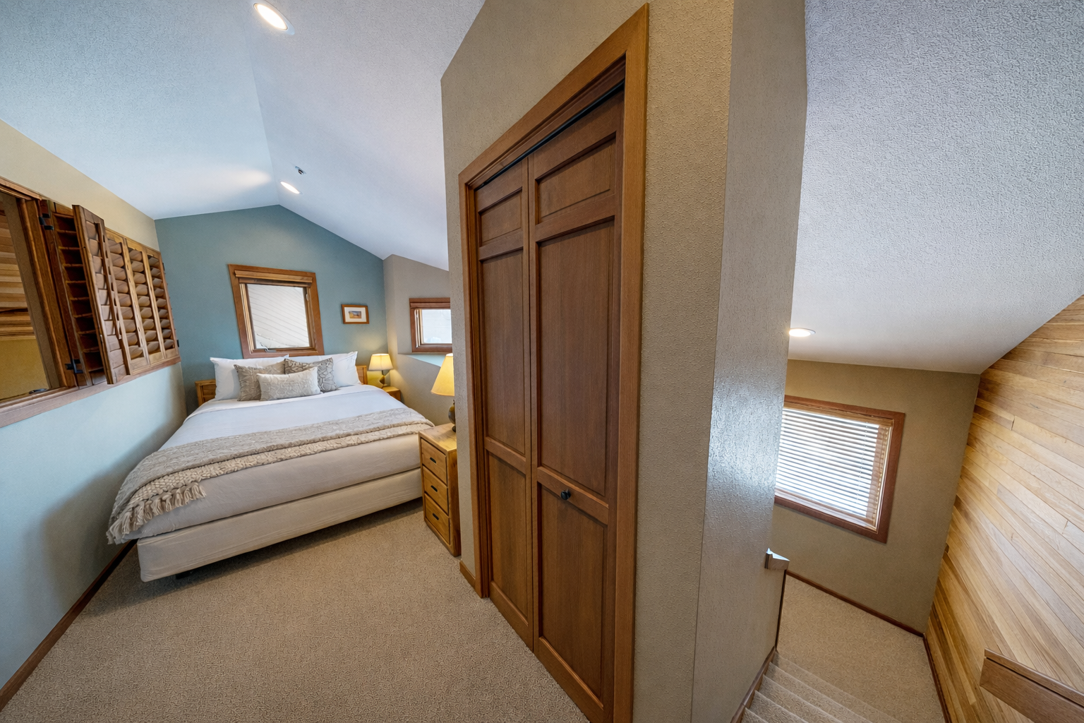 Step into your serene bedroom with warm wood finishes, cozy bedding, and thoughtful lighting that creates the perfect retreat.