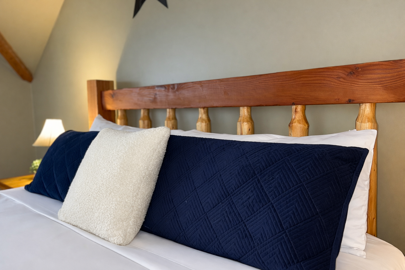 Relax in this spacious master suite on its own private floor. Features include a king-sized log bed, vaulted ceilings, and a large walk-in closet for the ultimate mountain retreat.