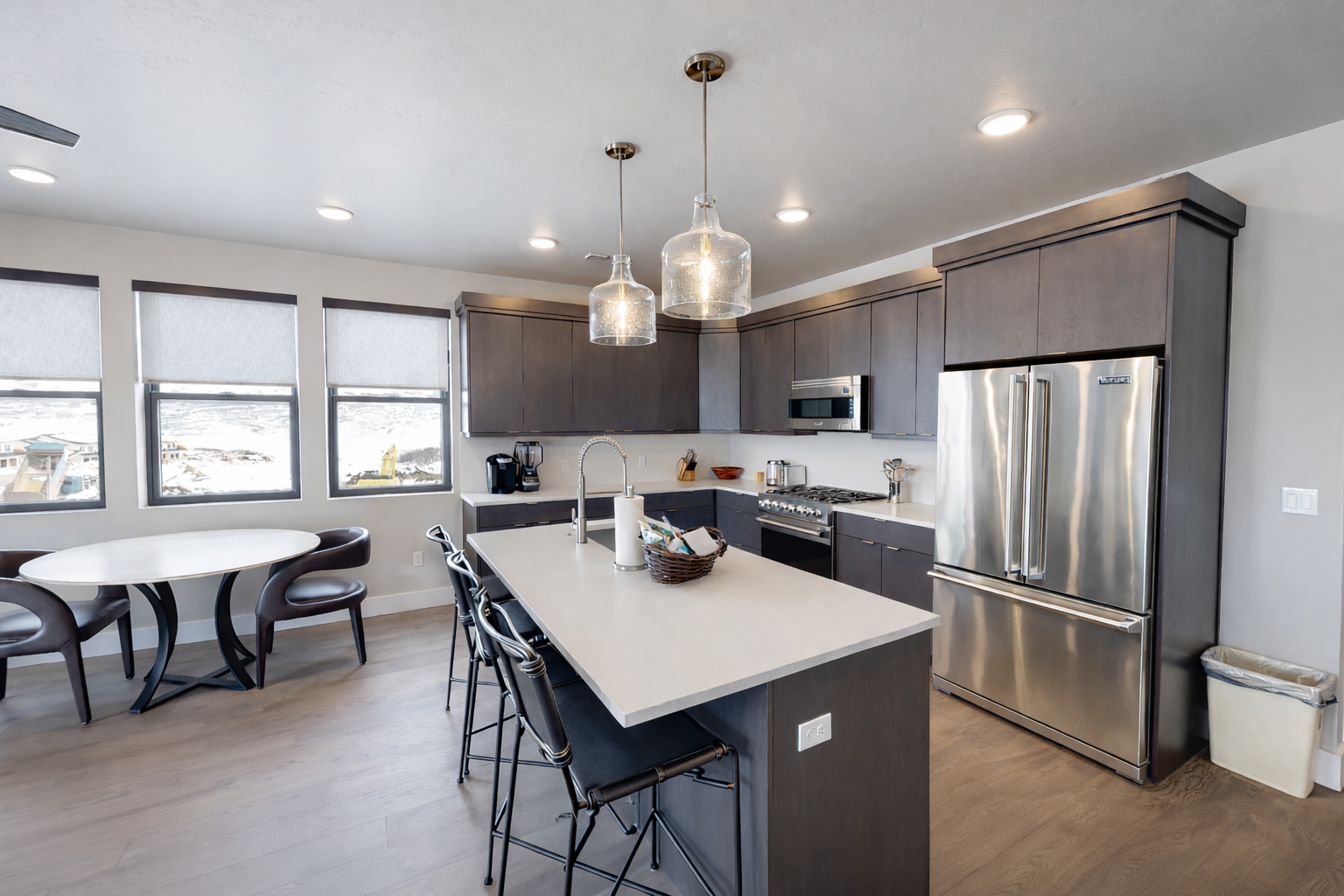 Experience bright, open-concept living in this modern space. Features include a gourmet kitchen with a large island, cozy dining area, and sun-drenched windows—perfect for a stylish group getaway.