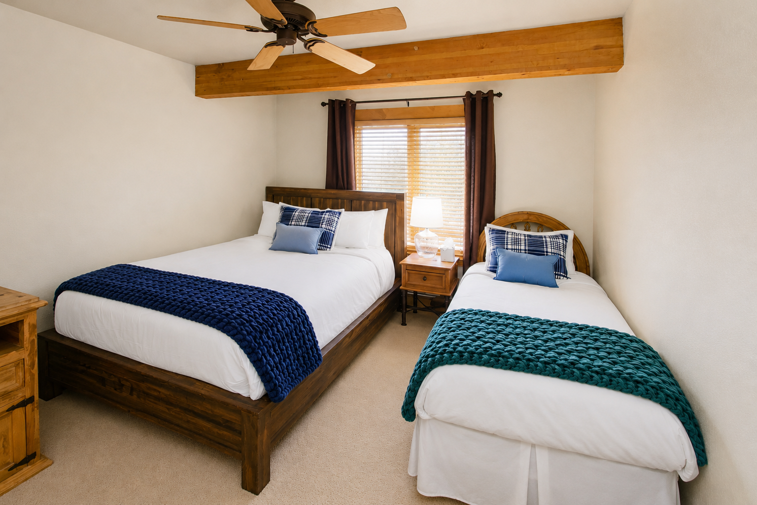 Relax in your cozy twin bedroom with rustic wood beams, crisp linens, and gentle natural light filtering through.