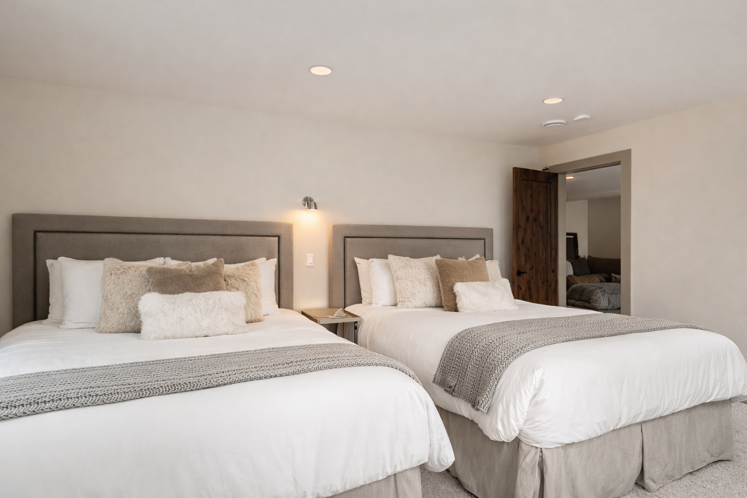 Comfortable fourth floor guest room with two plush twin beds and modern decor. A serene retreat for a restful Park City stay.