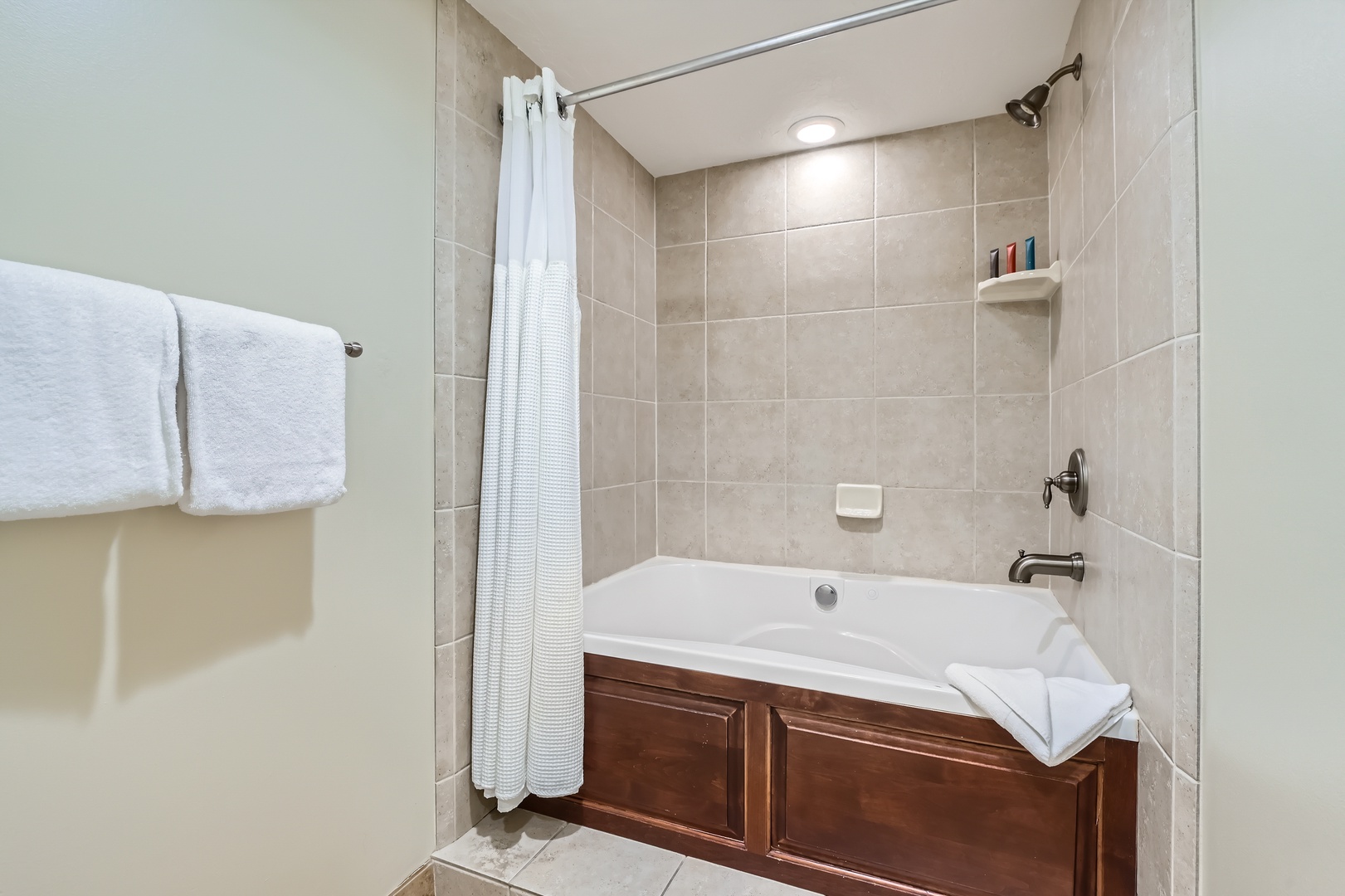 Slip into the soaking tub after a day of adventure—plush towels, warm tile, and a rainfall showerhead await your arrival.