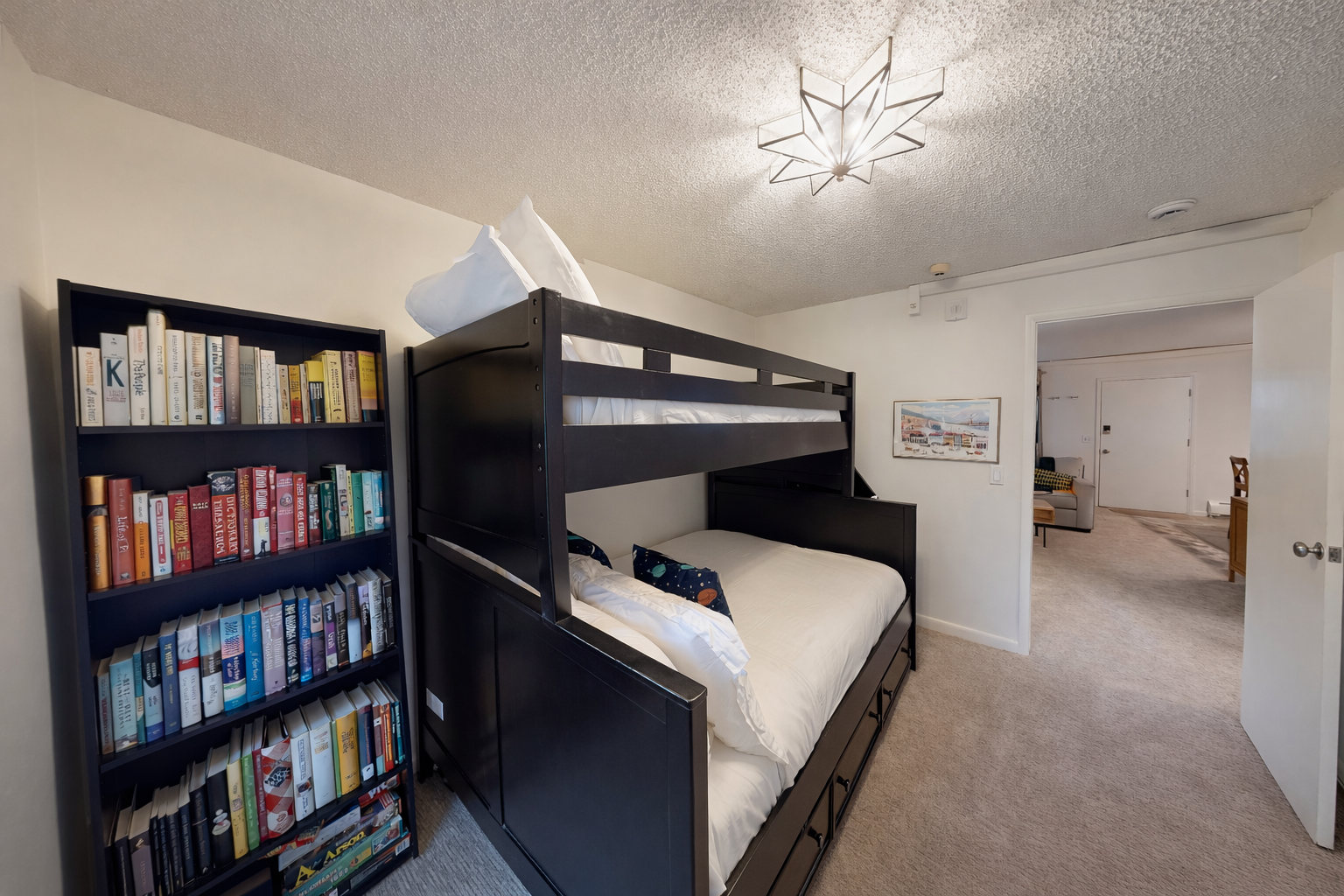 Your cozy reading nook features comfortable bunk beds and an extensive book collection, perfect for settling in with a good story after exploring the area.