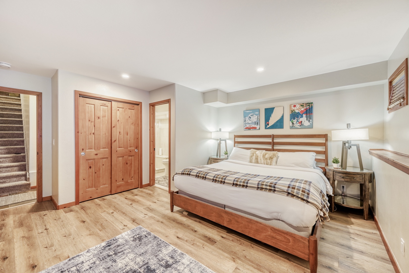 Retreat to your serene bedroom sanctuary featuring warm wood accents, crisp linens, and thoughtful lighting for ultimate relaxation.