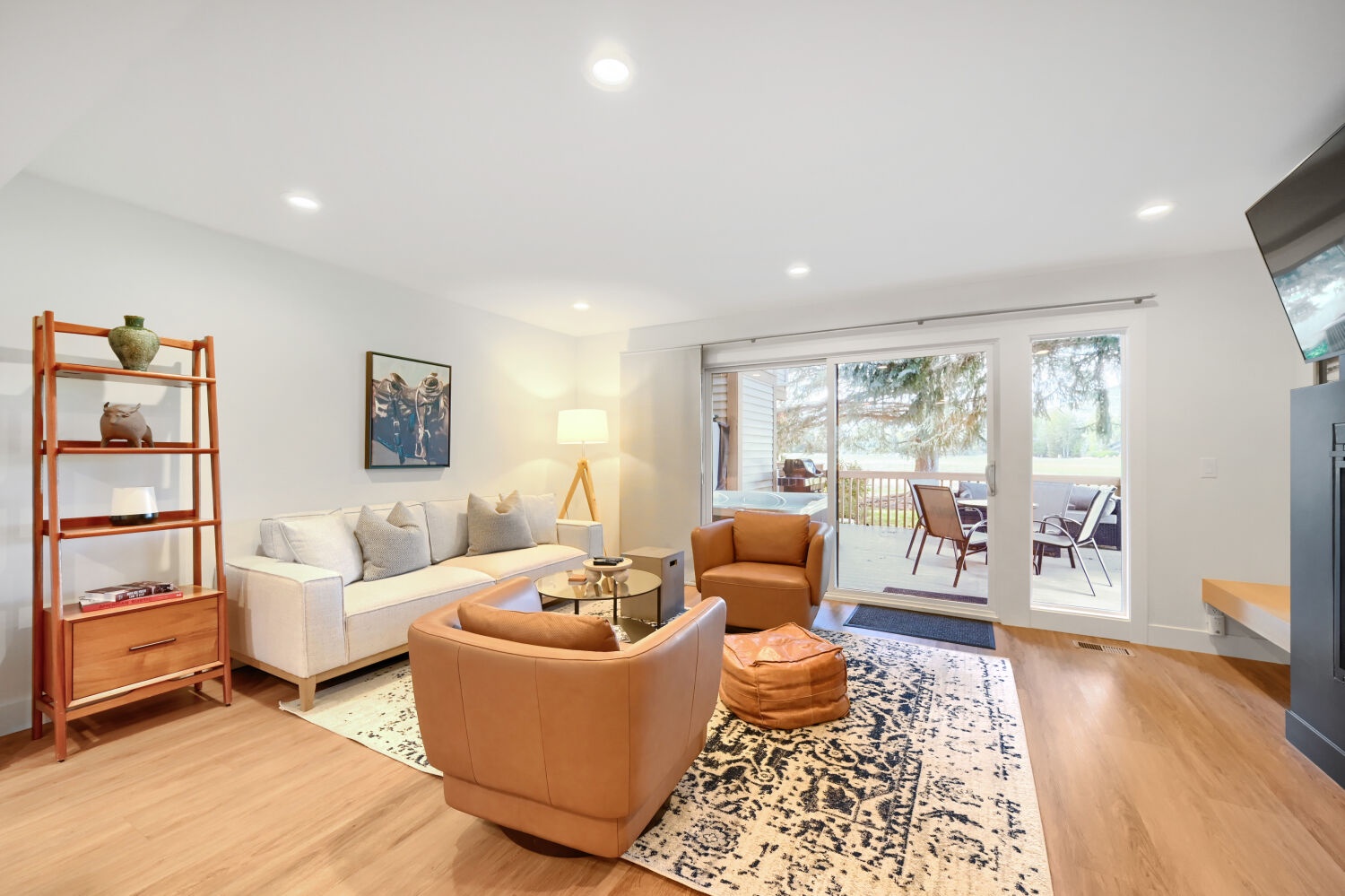 Sink into plush seating in your light-filled living room, where sliding glass doors open to a private balcony perfect for morning coffee or evening unwinding.