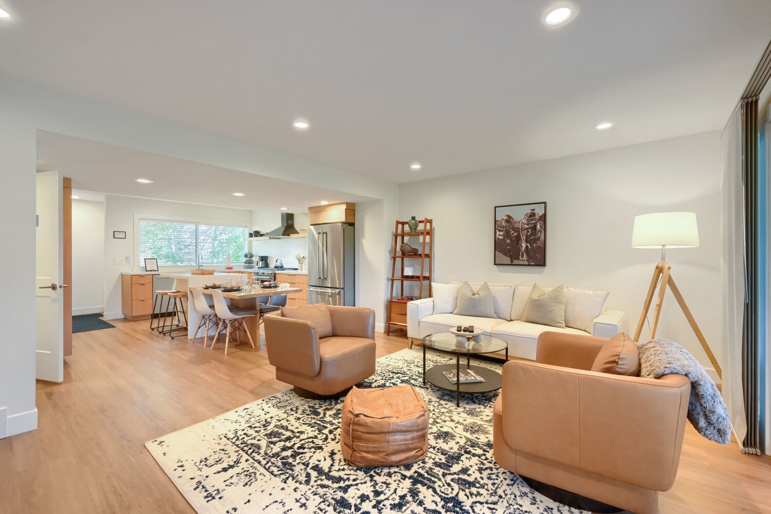 Bright, open living space with natural light and modern comfort. The kitchen invites cooking while staying connected to your group, with plush seating nearby to unwind.