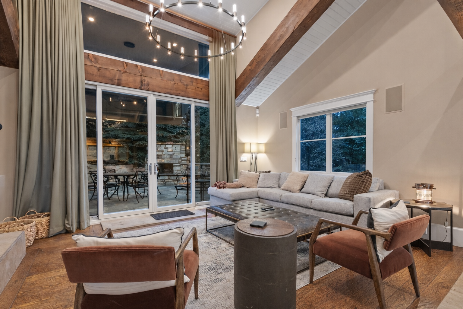 Unwind in your elegant living room with vaulted ceilings, cozy seating, and seamless access to your private outdoor patio space.