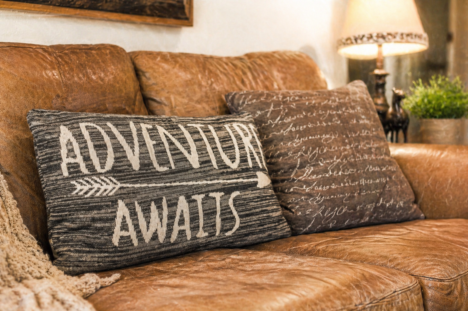 Sink into this inviting leather sofa where your next adventure awaits—plush cushions and warm lighting create the perfect spot to relax after a day of exploring.