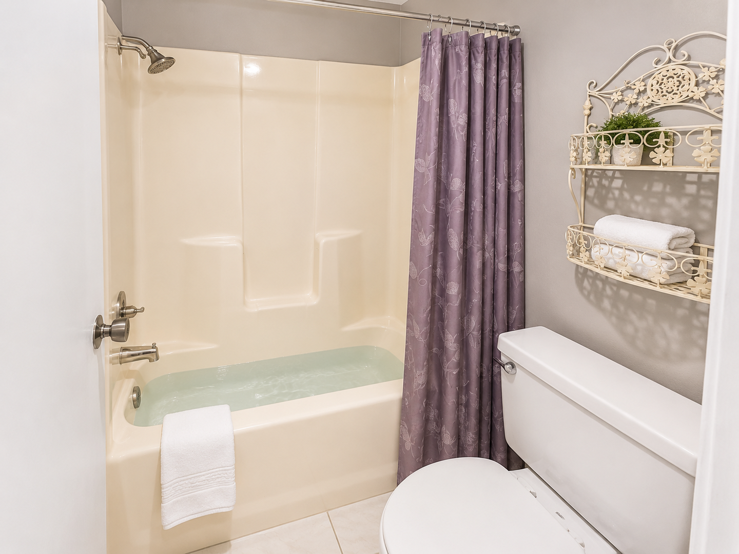 Refresh in the clean, modern primary ensuite bathroom, featuring a shower-tub combination and functional vanity. Bright and tidy for your convenience.