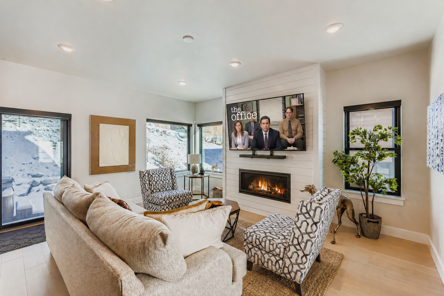 Unwind in your stylish living room where plush seating and a cozy fireplace create the perfect atmosphere for relaxing evenings together.