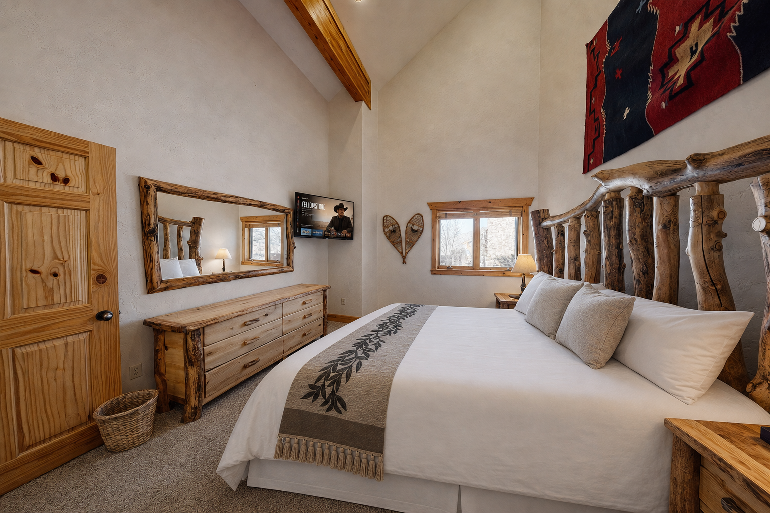 Sink into plush bedding beneath vaulted ceilings and rustic wooden beams, where natural light and cozy décor invite your most restful mountain getaway.