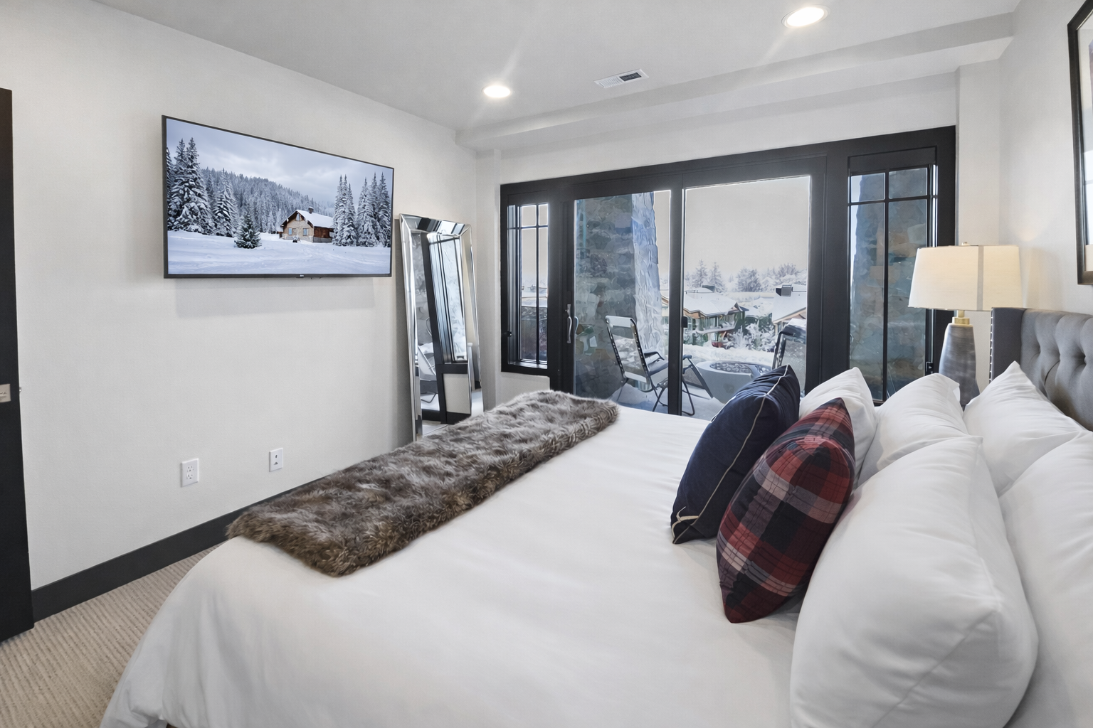 Unwind in your luxurious bedroom where crisp white linens and plush pillows promise the perfect night's rest.