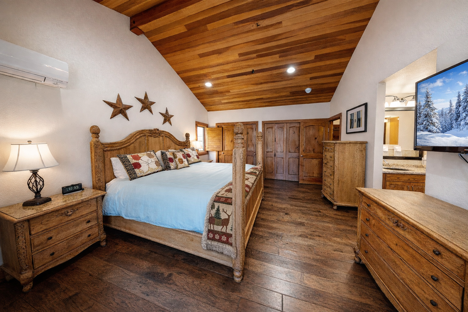 Drift into restful sleep beneath rustic wood beams in your cozy mountain retreat, where handcrafted furniture and warm touches create the perfect alpine sanctuary.