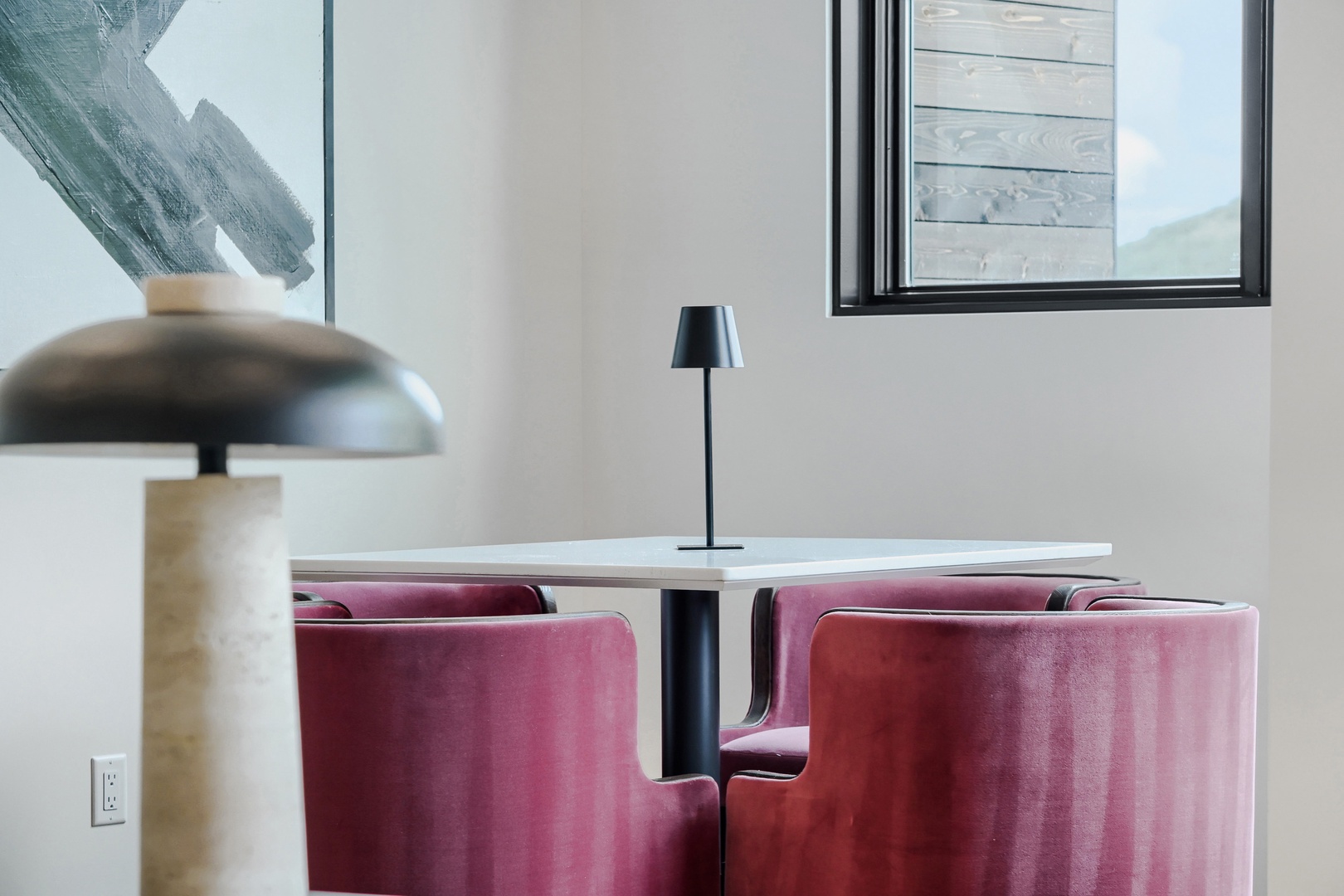 Settle into these plush velvet chairs and enjoy your morning coffee at this sleek modern dining spot, flooded with natural light.