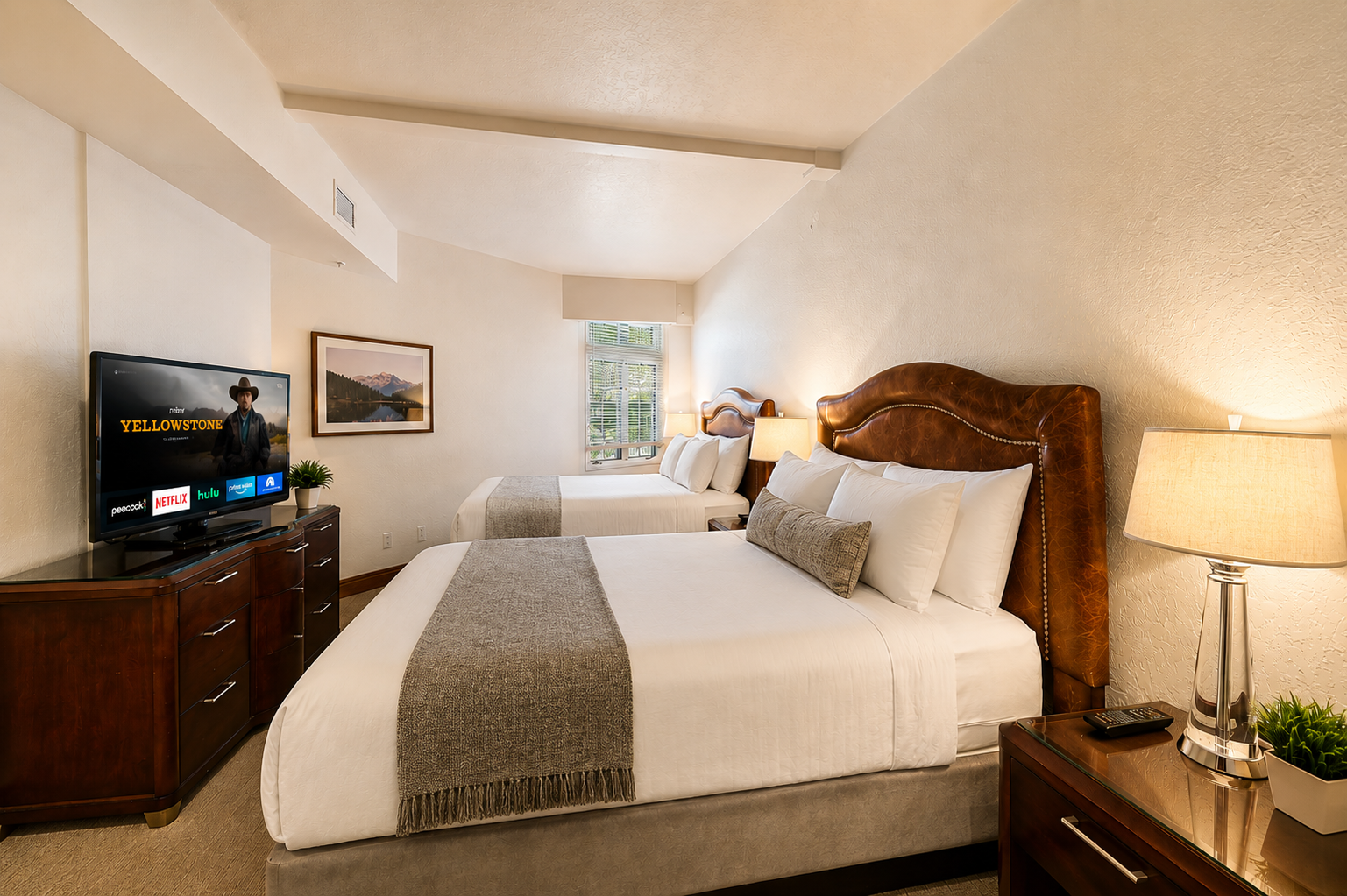Sink into plush bedding and unwind in your serene bedroom retreat, complete with cozy linens, warm lighting, and your favorite streaming entertainment ready to enjoy.