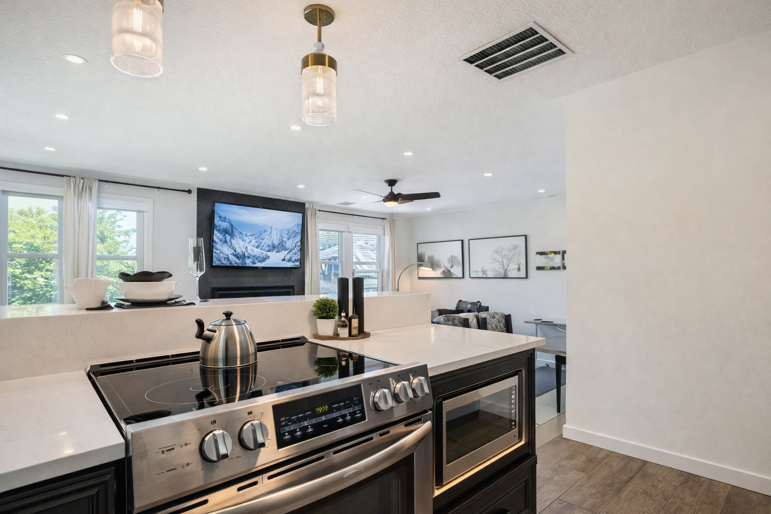 Fully-equipped kitchen with beautiful granite countertops, stainless steel appliances, and a spacious island with bar seating. Perfect for preparing meals during your stay.