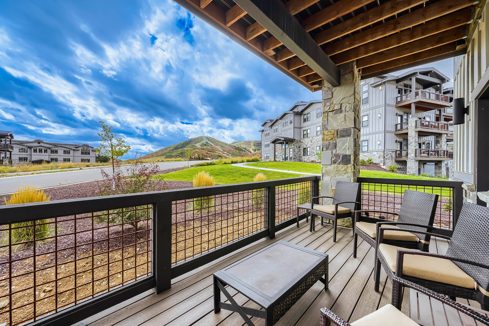 Step onto your private patio and take in sweeping mountain views framed by open sky. Comfortable seating invites you to unwind outdoors, surrounded by natural beauty and fresh air.