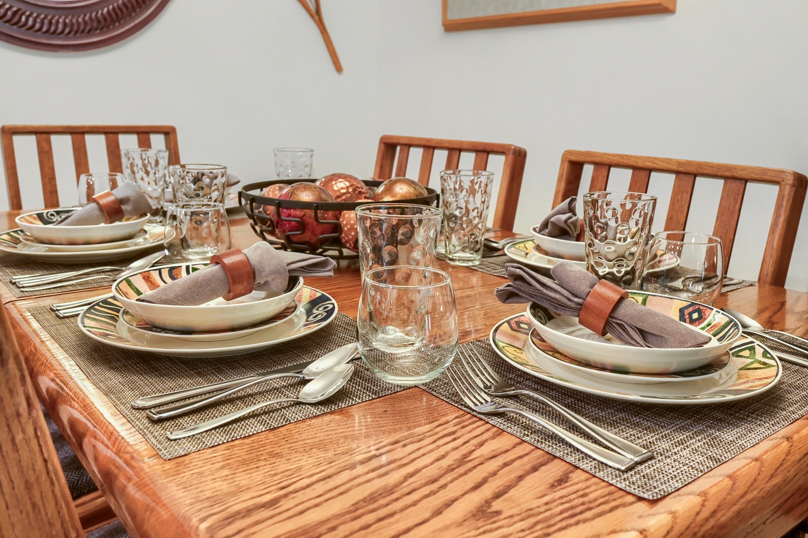 Gather around this beautifully set table where your vacation mornings begin with warm bread and conversation over artfully arranged place settings.