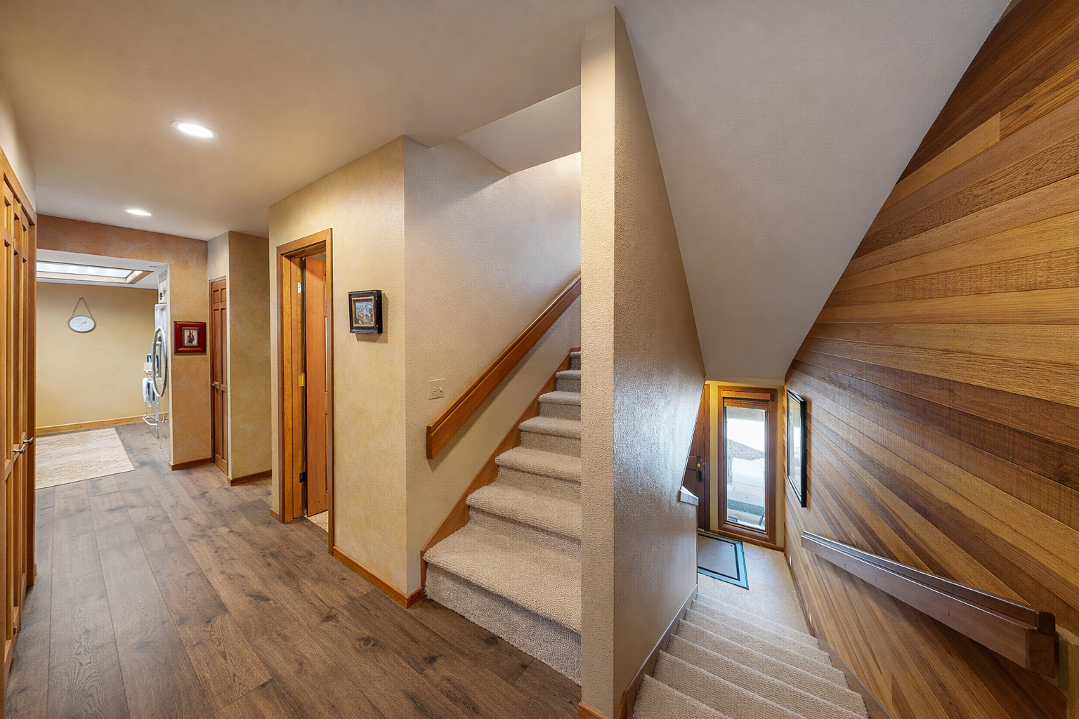 A warm and inviting staircase leads the way through this charming cabin home. Access to Hall Bathroom.