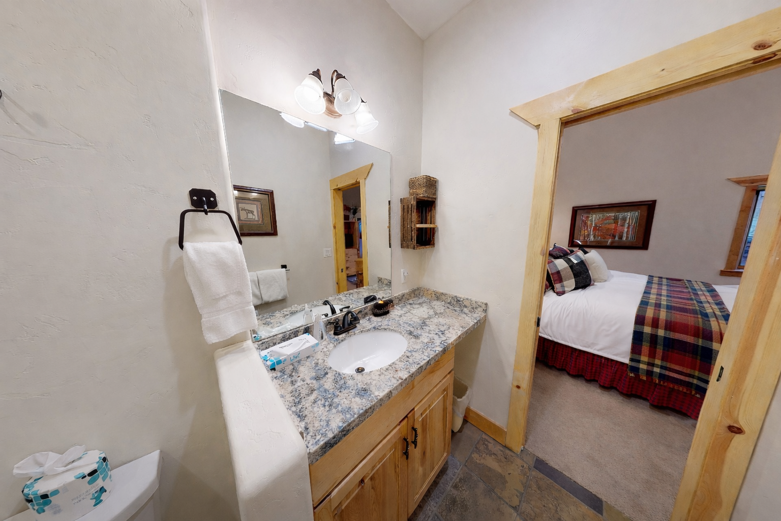 Your private bathroom features granite countertops and connects directly to your cozy bedroom for ultimate convenience.