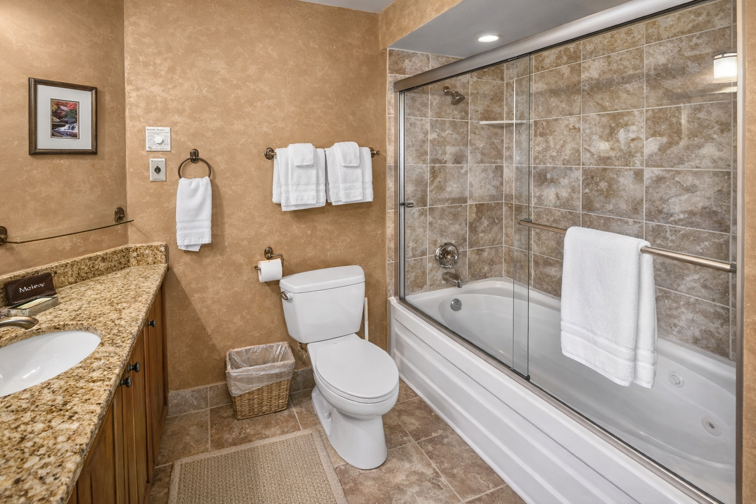 Enjoy our spacious and well-appointed private bathroom. Features include a large granite vanity, full tub/shower combo, and plush towels for a relaxing stay.