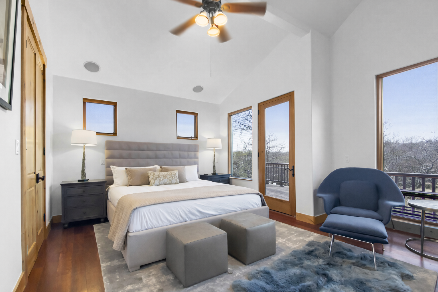 Relax in your serene master bedroom with mountain views, plush seating, and modern comfort.
