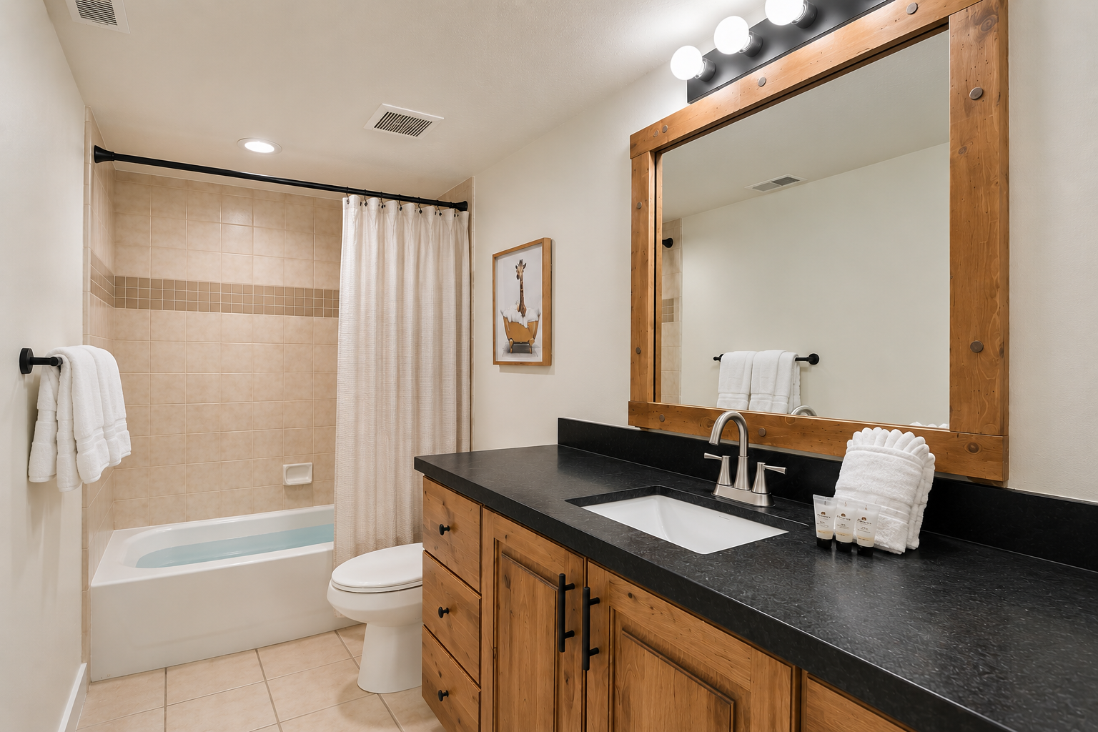 Relax and refresh in your private full bathroom, complete with a clean shower-tub combination, rustic wood vanity, and fresh white towels. This functional space offers all the comforts for your stay.