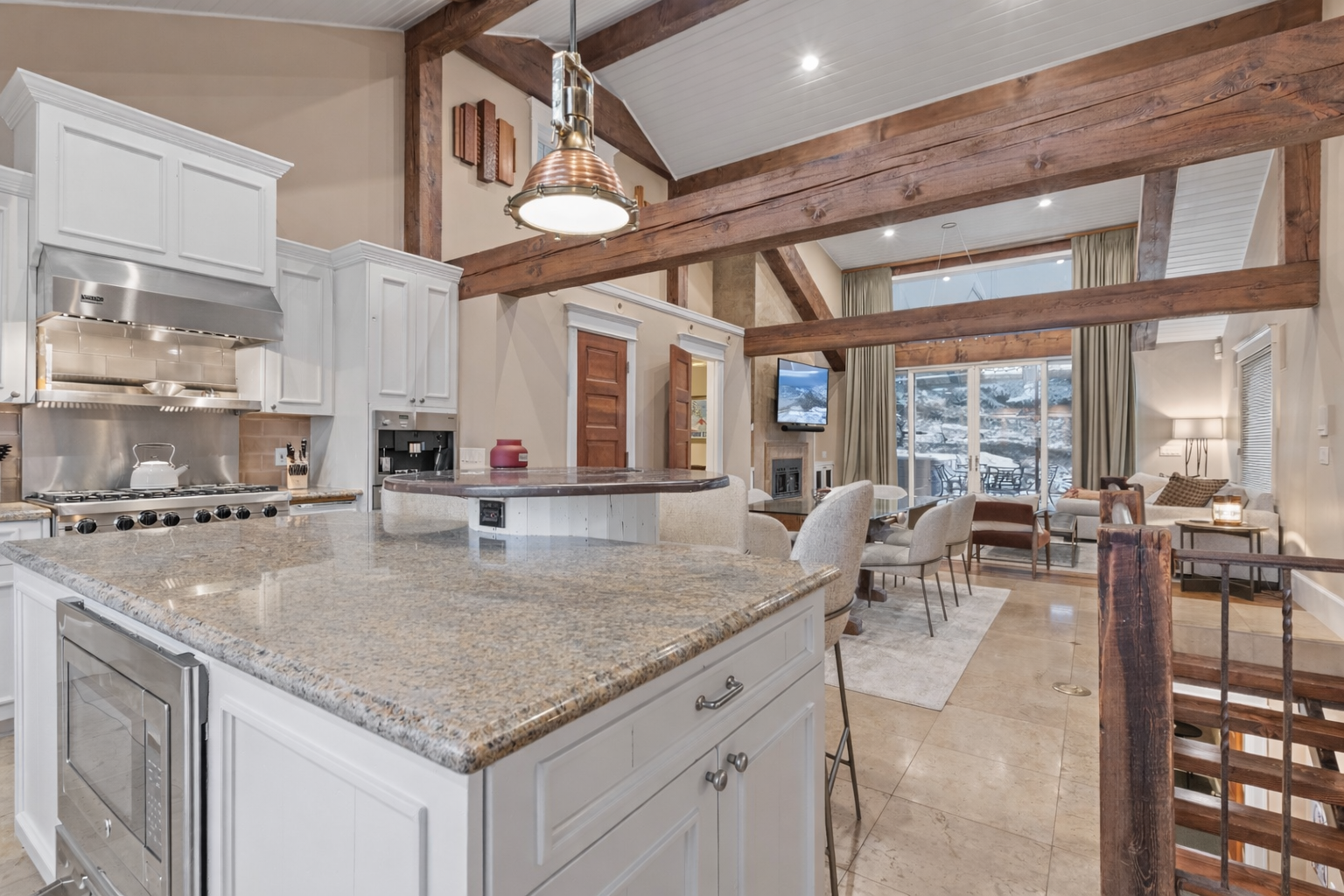 Welcome to mountain luxury! This beautifully updated home features an open-concept kitchen/living area with exposed beams, perfect for entertaining or relaxing after a day exploring Park City.