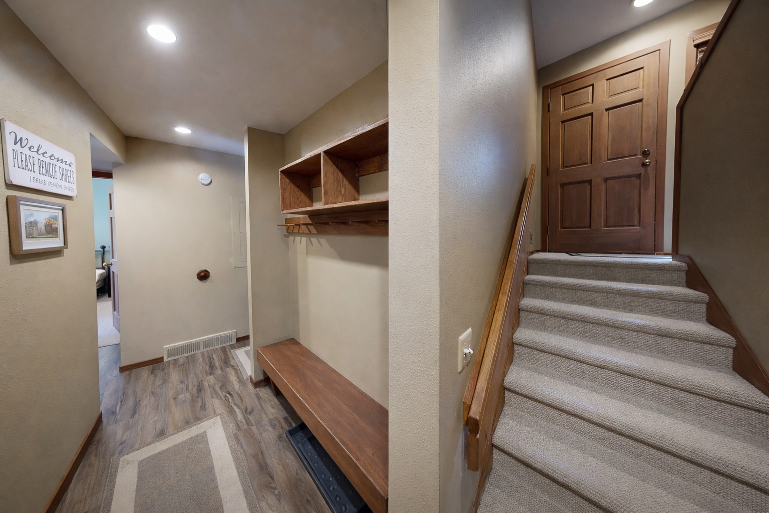 Step into your welcoming entryway with convenient coat storage and a cozy bench—perfect for stashing gear after a day of adventure.