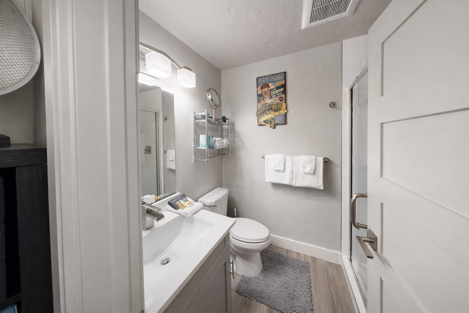 Fresh towels and thoughtful touches await in your private bathroom, complete with modern fixtures and cozy amenities for your comfort.