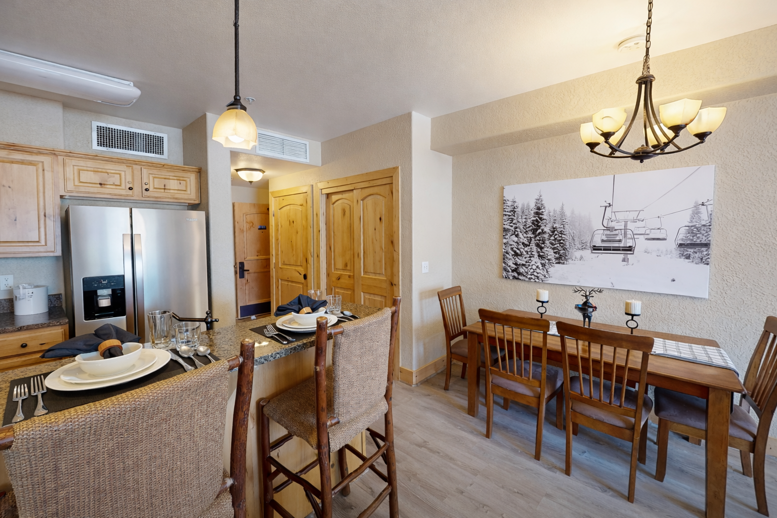 Whip up gourmet meals in this fully equipped kitchen featuring sleek granite countertops, modern stainless steel appliances, and elegant pendant lighting. The open layout makes hosting a breeze!