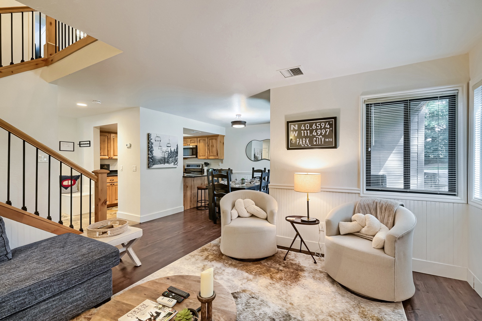 Step into your welcoming open-concept retreat, where natural light pours through large windows and cozy furnishings invite you to unwind after a day of exploring.