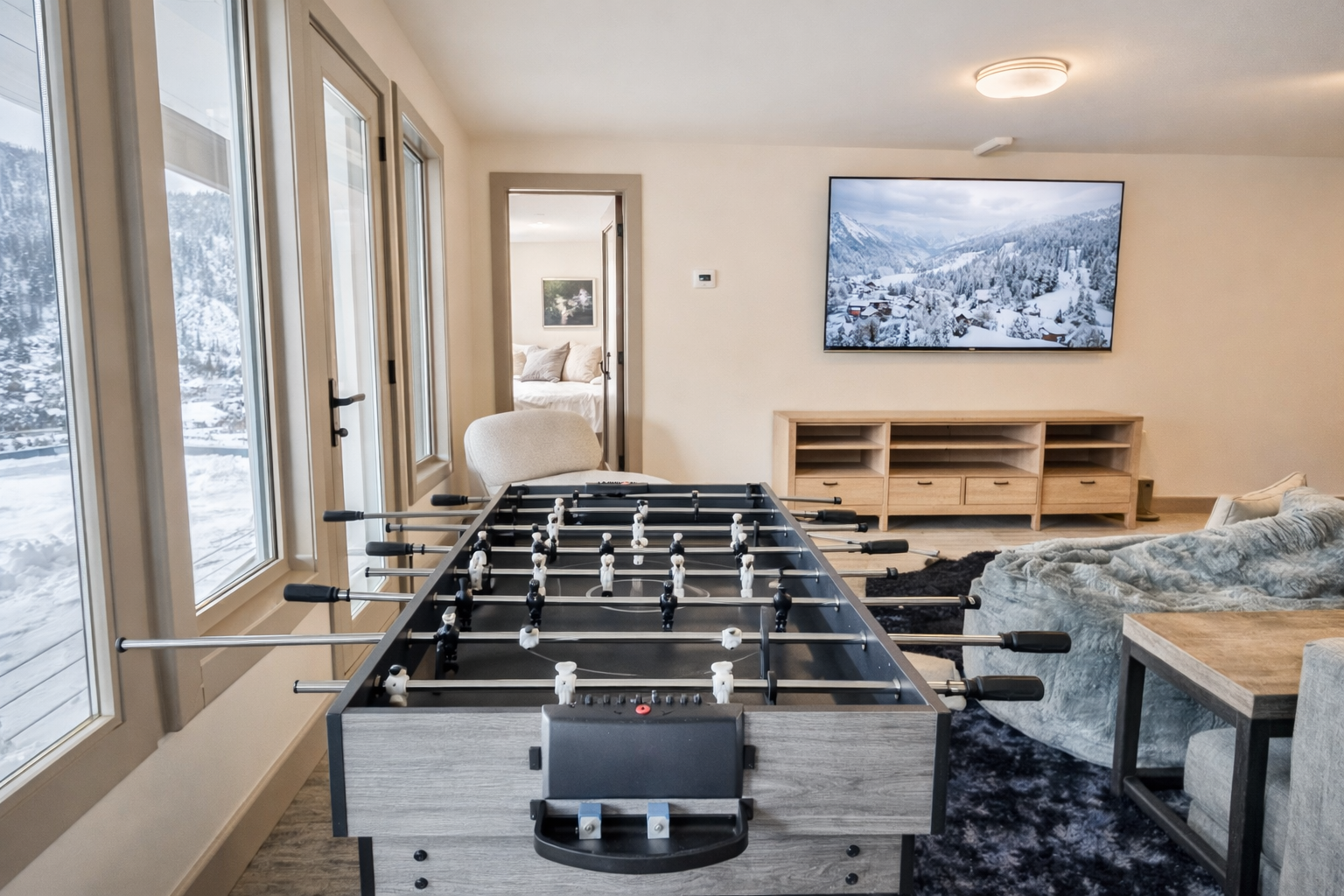 Challenge friends to foosball while enjoying stunning mountain views through floor-to-ceiling windows in this bright entertainment space.