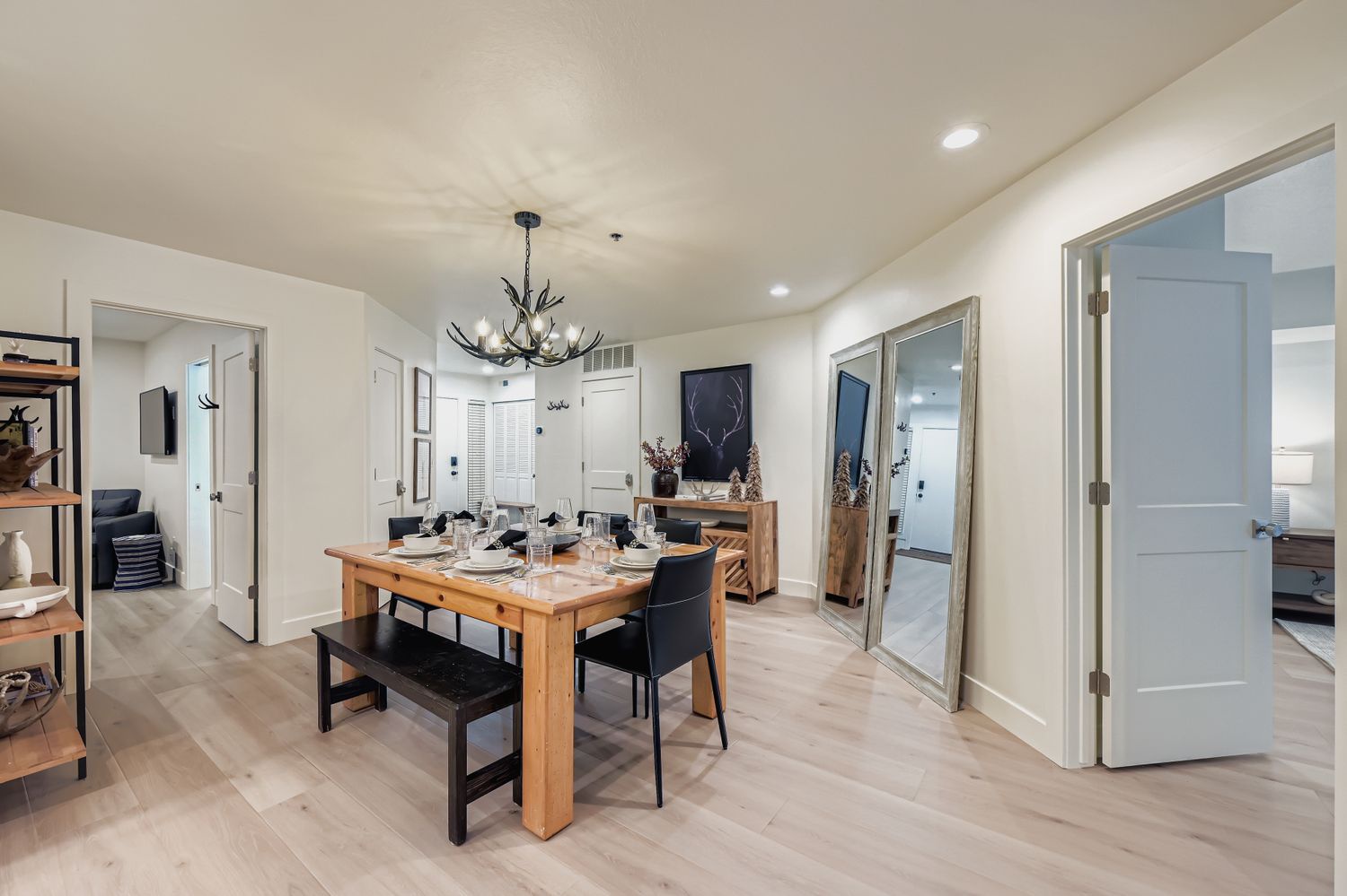 Gather around your elegant dining table for memorable meals with loved ones in this beautifully appointed space featuring rustic wood furnishings and modern touches.