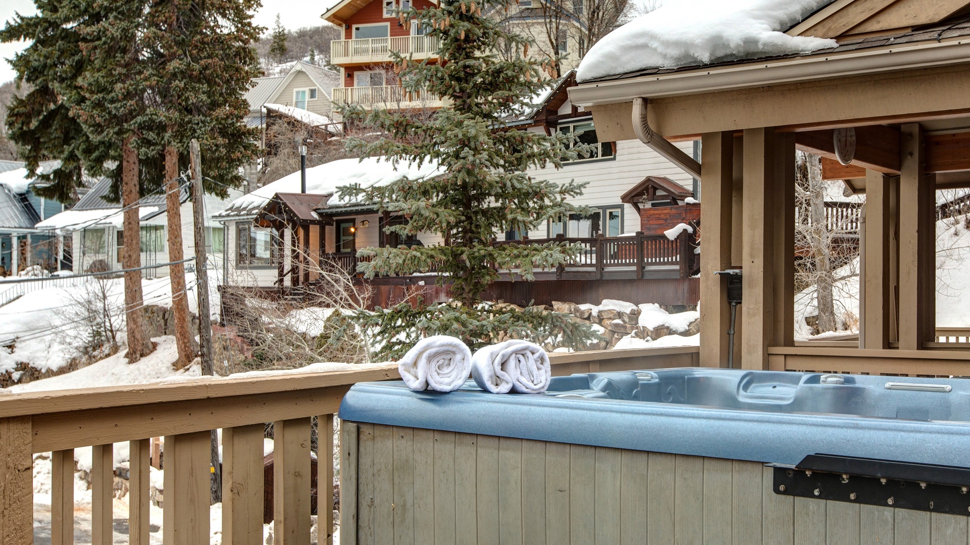 Soak in your private hot tub with fluffy towels at hand while snow-covered pines create a magical winter wonderland around you.