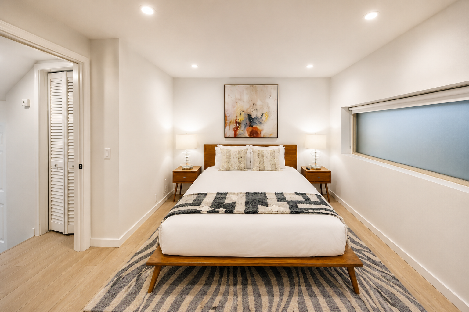 Unwind in your serene bedroom with mid-century modern charm, plush linens, and warm lighting that invites restful sleep after a day of adventure.