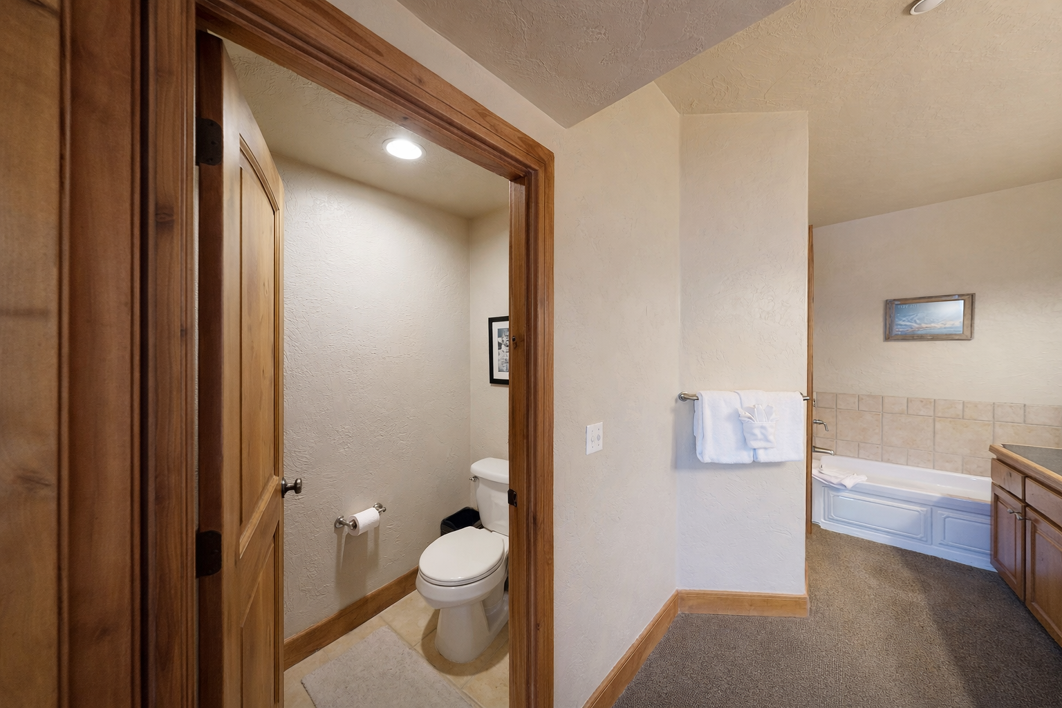 Spacious bathroom featuring a convenient double vanity and a relaxing tub/shower combination. Enjoy ample counter space, storage, and lighting for a seamless morning routine!