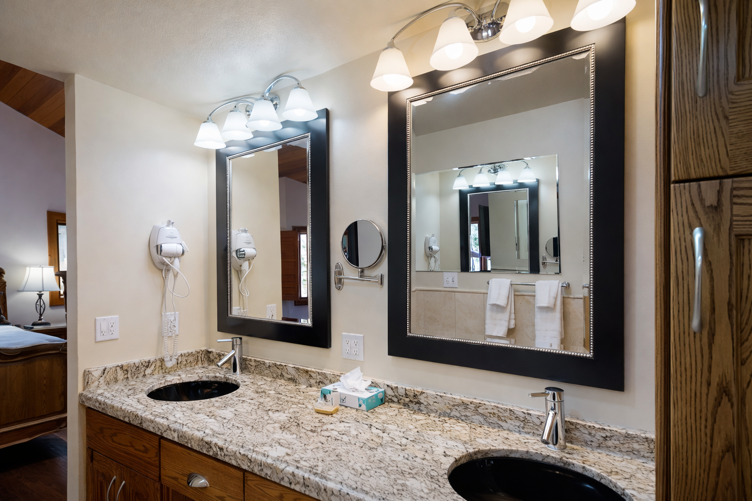 Enjoy the spacious double vanity, ample counter space, and well-lit mirrors. This clean, functional bathroom is perfect for getting ready during your Park City stay.
