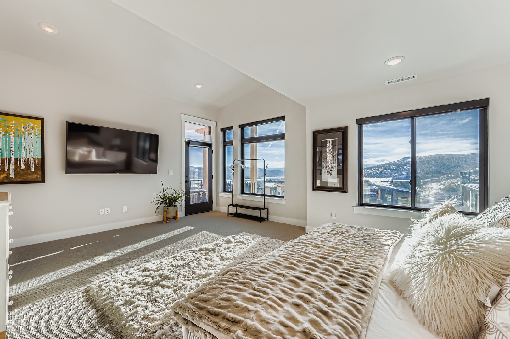 Wake up to stunning mountain and valley vistas through floor-to-ceiling windows that frame your private retreat. The spacious layout and doors opening to your balcony invite you to step outside and breathe in the scenery.