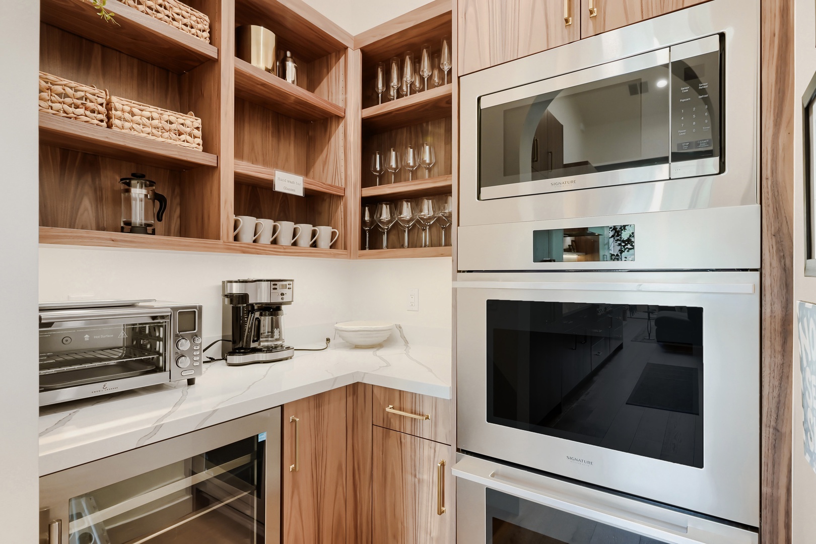 Your fully equipped kitchen makes it easy to prepare meals and gather with loved ones, blending thoughtful design with warm, natural textures.