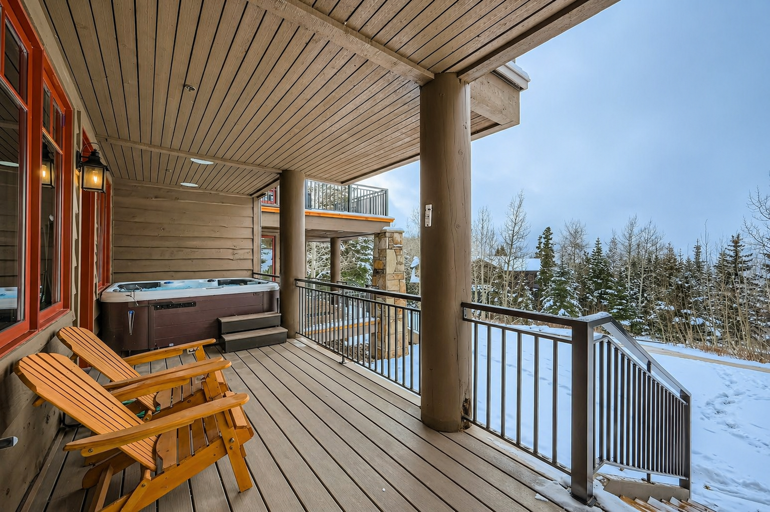 Indulge in a soak after a day on the slopes in your private hot tub with endless mountain views.