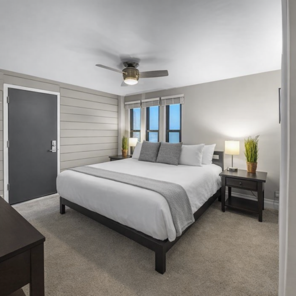 Settle into your peaceful bedroom retreat with crisp linens, modern furnishings, and gentle ceiling fan breeze for the perfect night's rest.