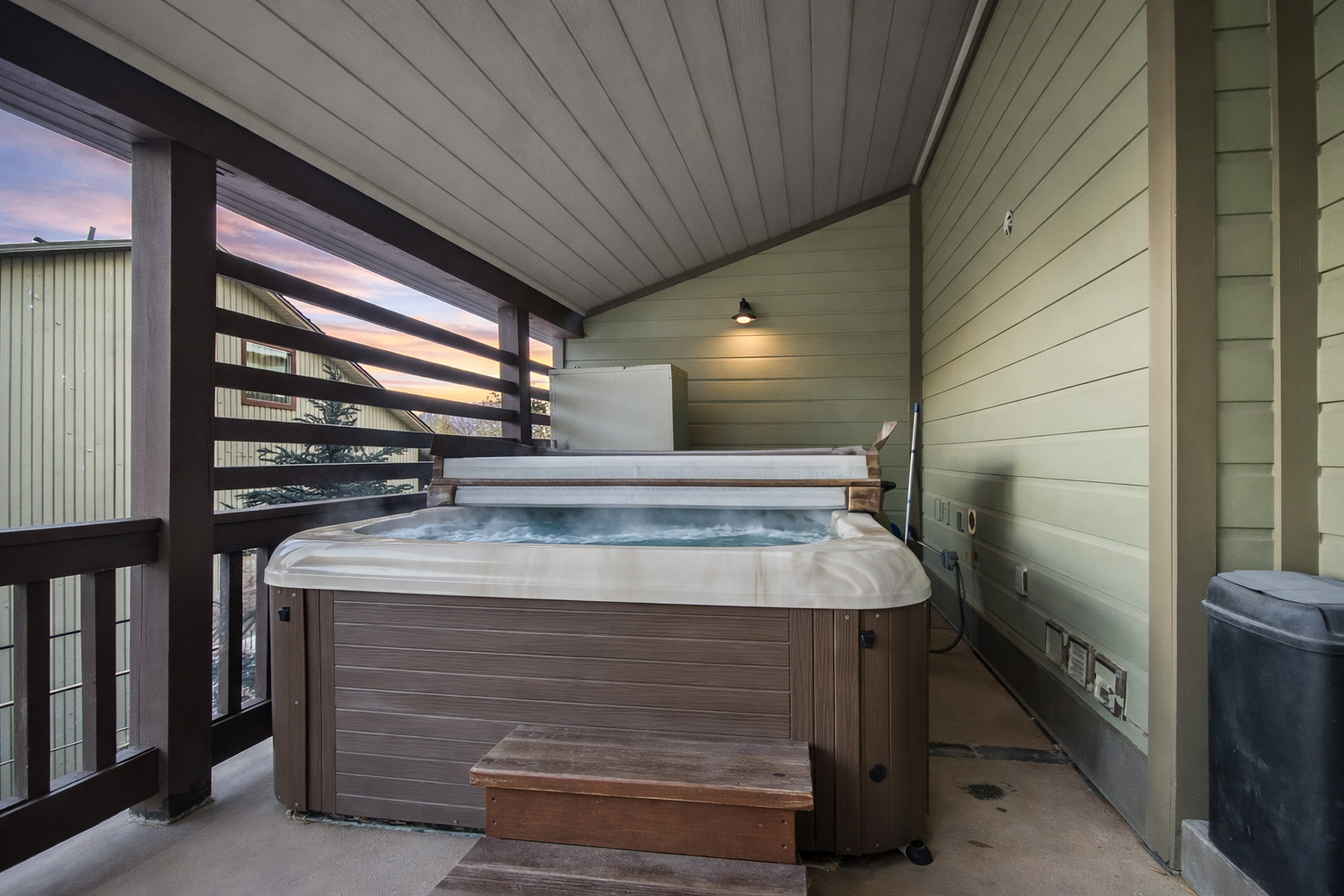 Soak away your stress in your private hot tub, nestled on a covered balcony with mountain views.