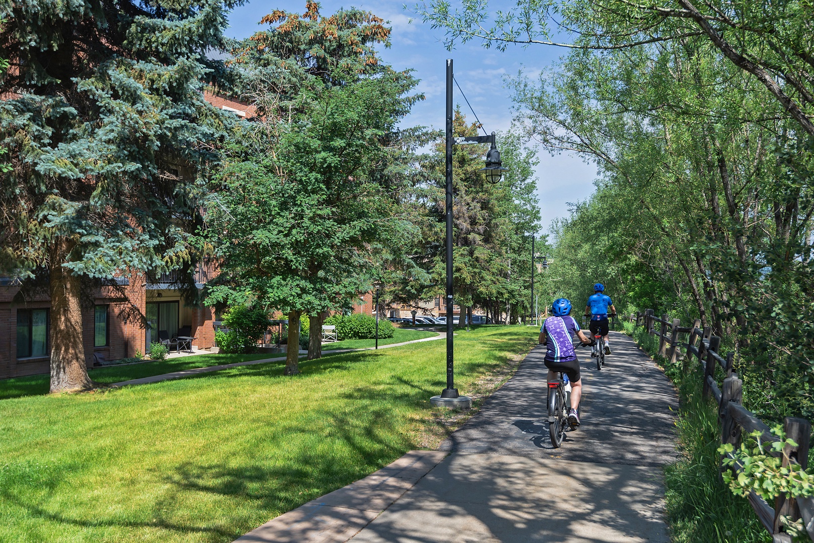 The property sits in a peaceful, tree-lined neighborhood with easy access to scenic bike paths and green spaces perfect for outdoor exploration.