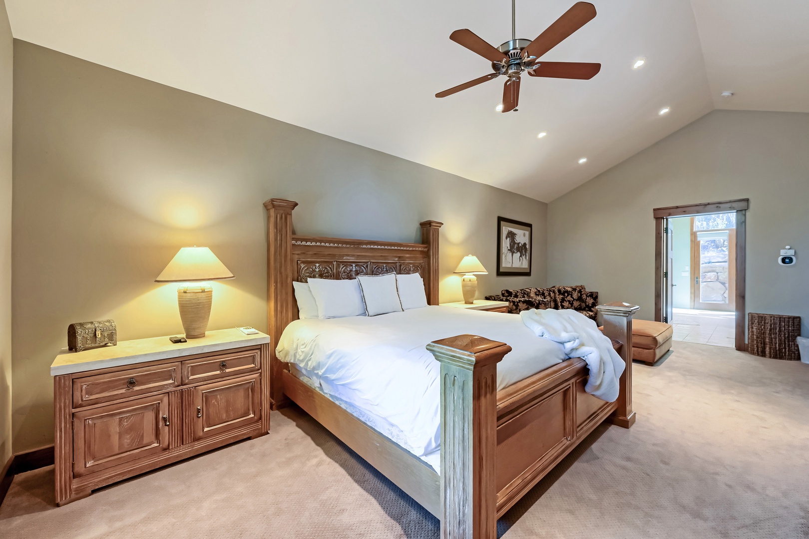 Sink into crisp linens and let the ceiling fan's gentle breeze lull you into your most restful night yet in this spacious, thoughtfully furnished retreat.