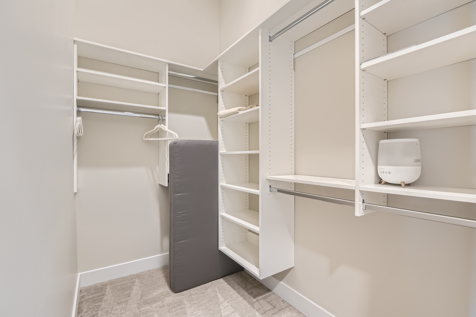 Your generous walk-in closet offers custom shelving, hanging space, and even a small safe to keep your valuables secure during your stay.