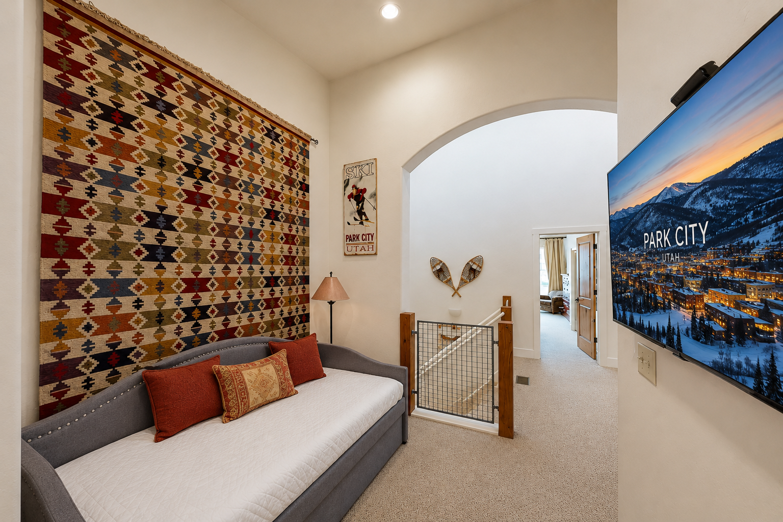 Relax in your cozy guest room featuring mountain lodge décor, warm accents, and a charming archway leading to more of your home away from home.